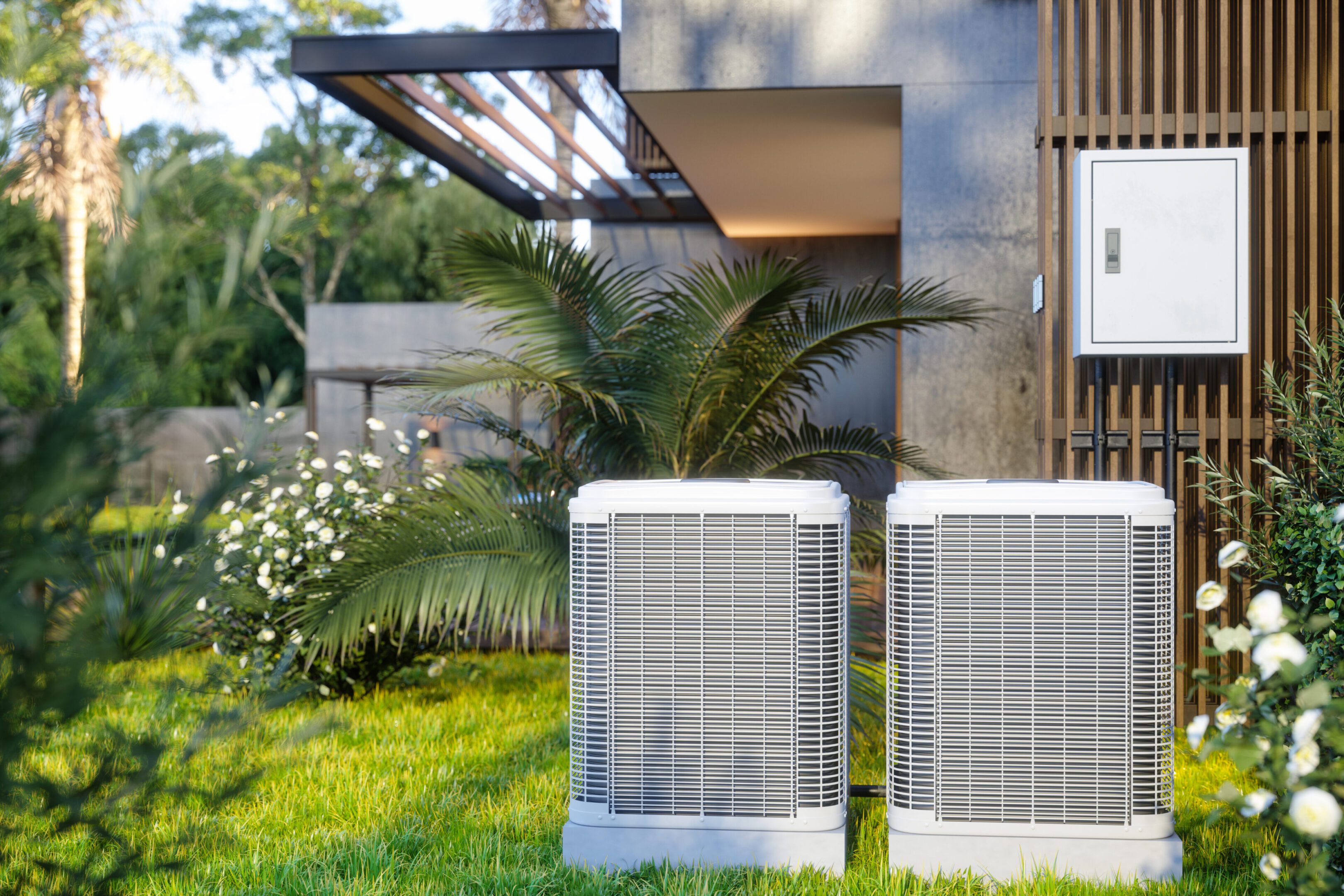 Two outdoor air conditioning units near house.