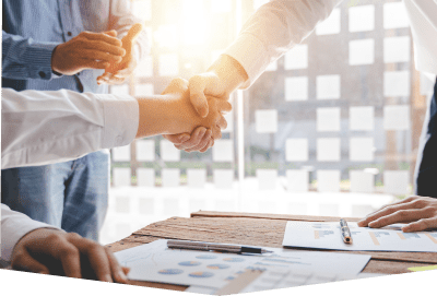 Business handshake in a sunny office.